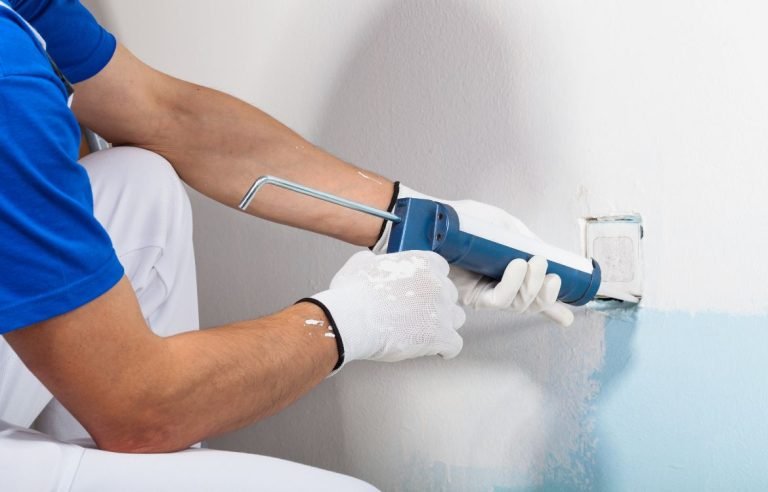 Caulking between wall and socket