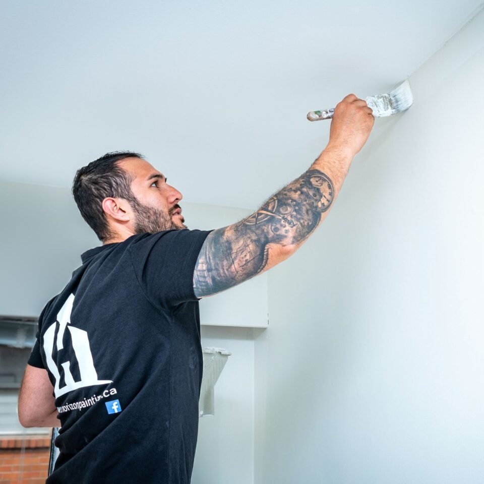 Painting the wall with a brush