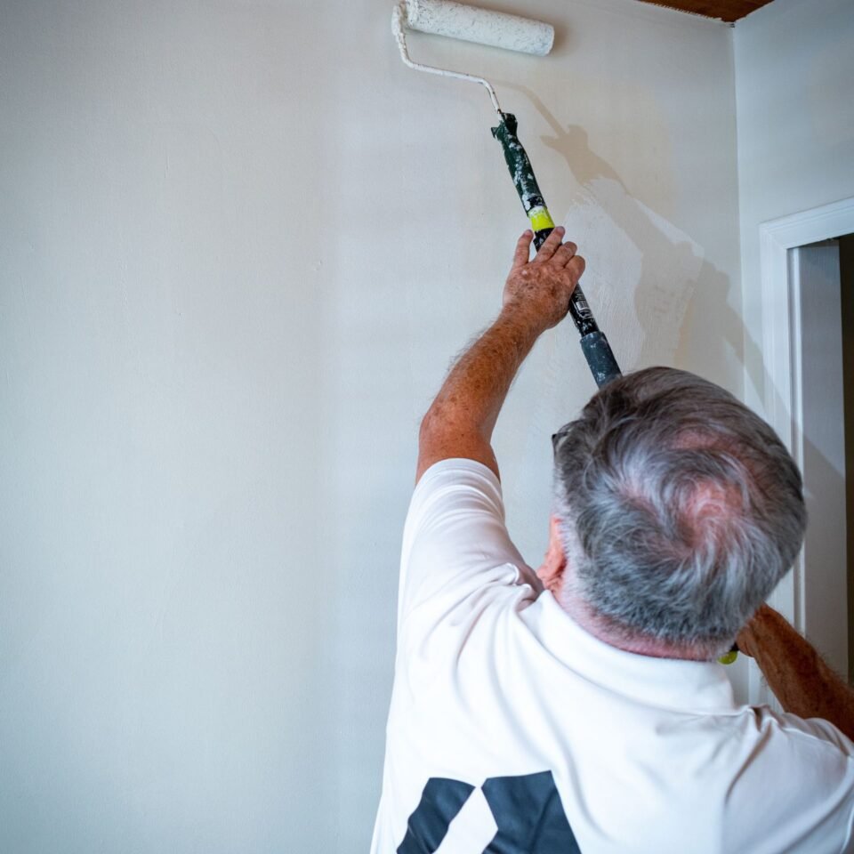 Painting the wall with a roller